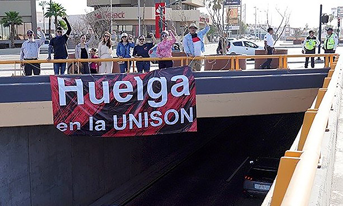 Coloca Staus lonas en puentes ; Advierten por posible huelga en la Unison